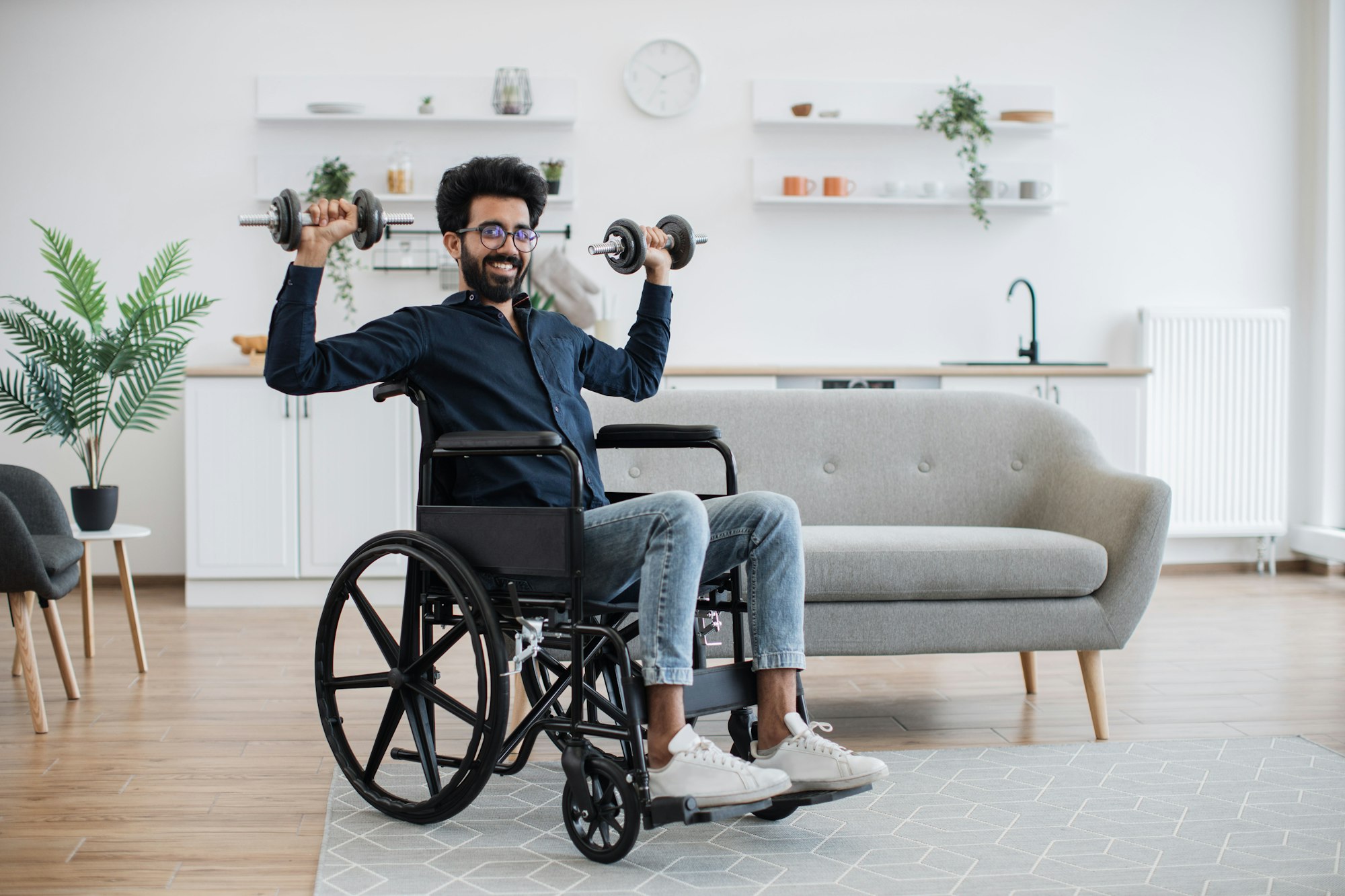 Man with limited mobility lifting weights at home workout